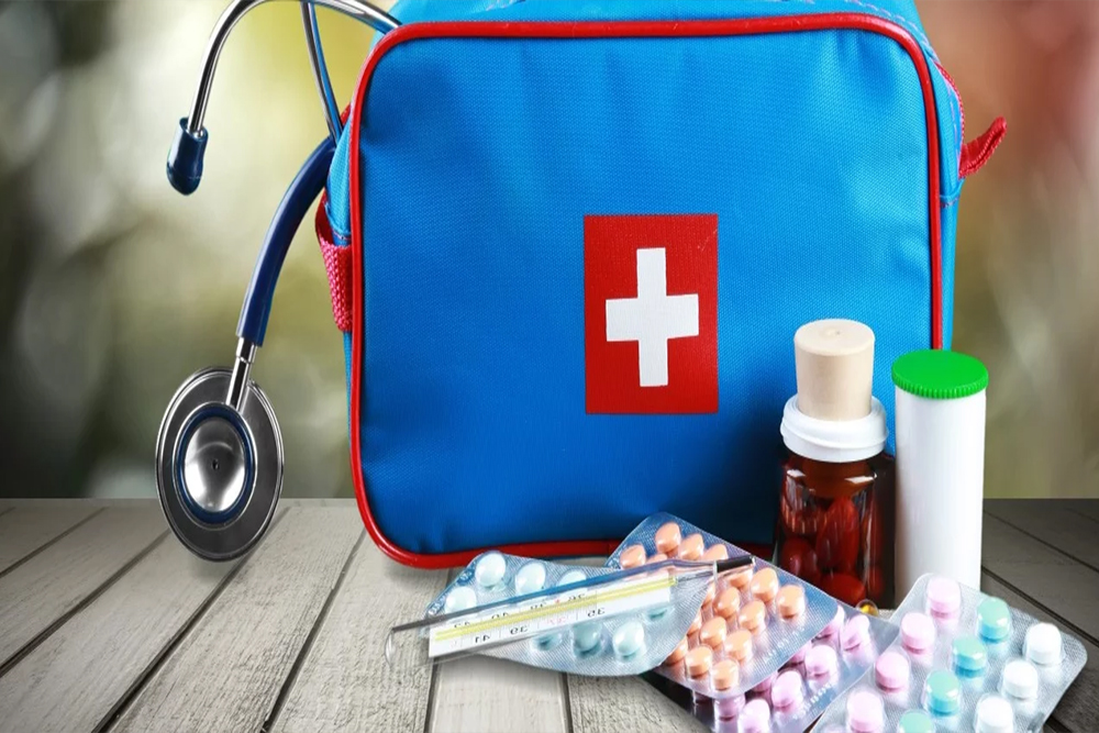 What should the first aid kit contain?